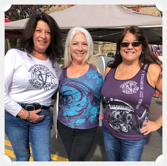 Three cool girls at The Nevada Day Parade by Virginia City Motorcycle Co.