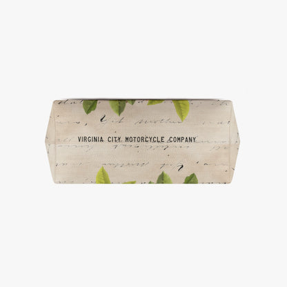 A rectangular beige canvas pouch with a green leaf pattern and black cursive script, featuring the text 'VIRGINIA CITY MOTORCYCLE COMPANY' printed on the front, set against a plain white background.