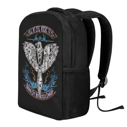 Side view of the "I Tell My Evil Where to Fly" black biker backpack featuring the VCMCo. eagle skull graphic — motorcycle lifestyle accessory by Virginia City Motorcycle Company