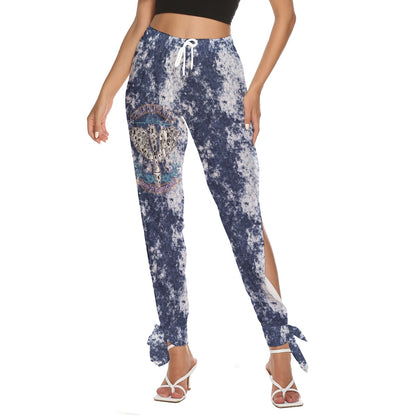 Front view of "I Tell My Evil Where to Fly" navy acid-wash side cutout pants with ankle strap ties and VCMCo. eagle skull biker graphic — women's motorcycle apparel