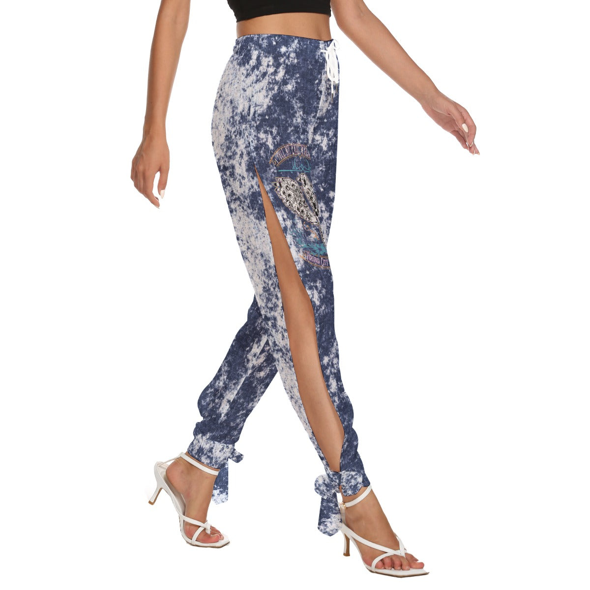 Right Side view of "I Tell My Evil Where to Fly" navy acid-wash side cutout pants with ankle strap ties and VCMCo. eagle skull biker graphic — women's motorcycle apparel