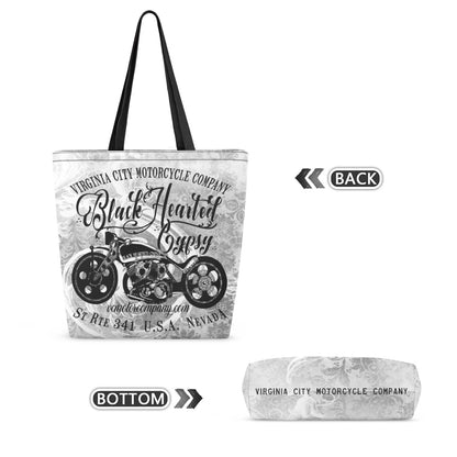 A tote bag with a black and white western motorcycle graphic and text reading 'Virginia City Motorcycle Company' and 'Black Hunted Gypsy,' shown alongside a folded view labeled bottom and a back view label on a white background.