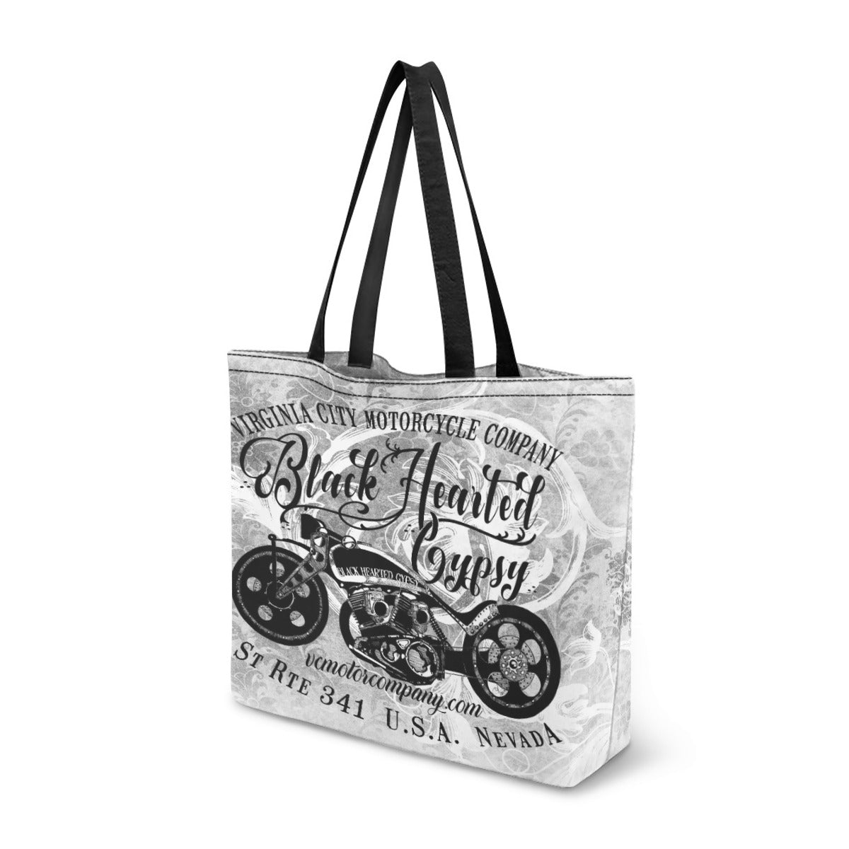 VCMCo. Black Hearted Gypsy canvas tote bag — black handles, bold chopper motorcycle graphic with ornate script lettering, Virginia City Motorcycle Company Nevada design