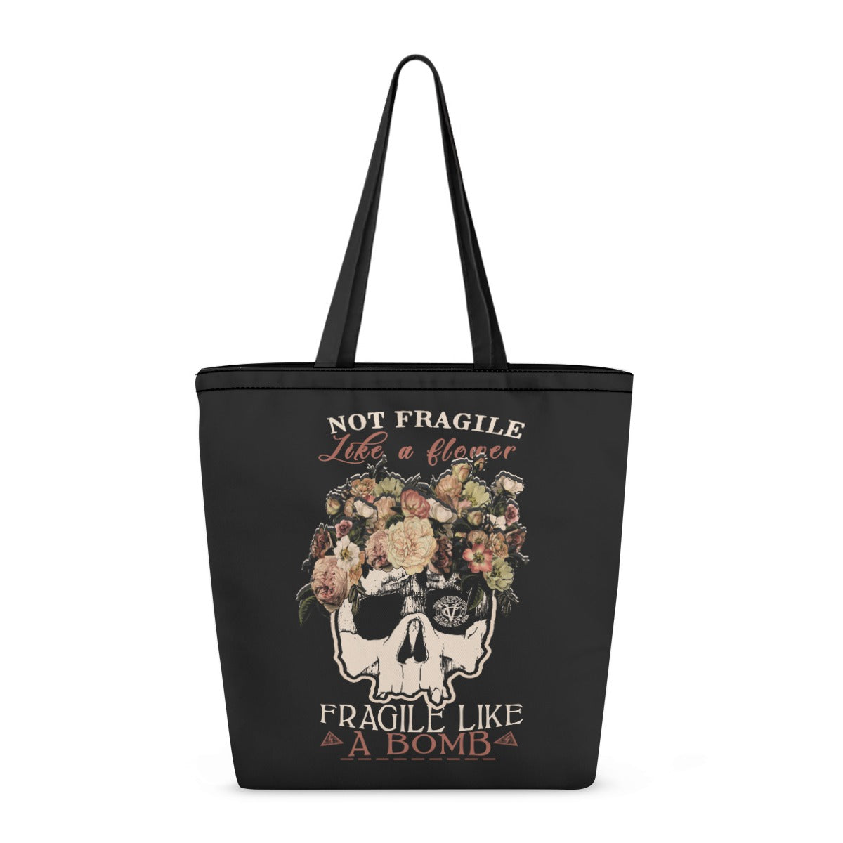 VCMCo. Fragile Like a Bomb canvas tote bag — black canvas with floral skull graphic and "Not Fragile Like a Flower, Fragile Like a Bomb" text in mixed script and block lettering