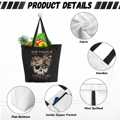 VCMCo. Fragile Like a Bomb canvas tote bag — black canvas with floral skull graphic and "Not Fragile Like a Flower, Fragile Like a Bomb" text in mixed script and block lettering