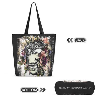 Black tote bag with a large floral skull graphic on the front, shown alongside a matching black pouch and printed text reading 'VIRGINIA CITY MOTORCYCLE COMPANY'. The image includes orientation labels 'BACK' and 'BOTTOM' on a white background.