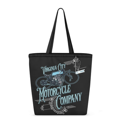 A black canvas tote bag with long shoulder straps, featuring a vintage-style graphic of a motorcycle and the text 'Virginia City Motorcycle Company' in light blue and white on a plain white background.