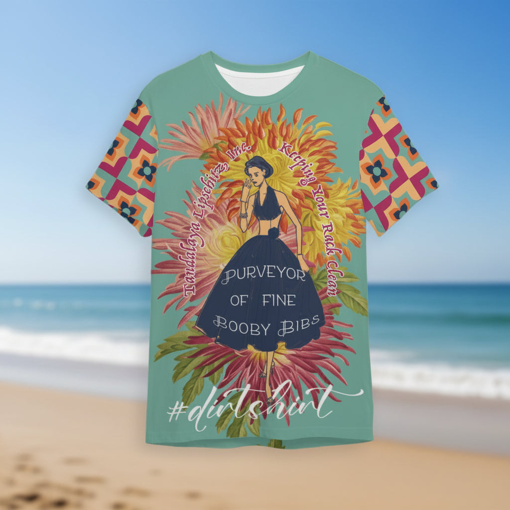 a teal Tandalaya Lipschitz #dirtshirt short sleeve tee, hovering over a blurred beach scene — VCMCo.